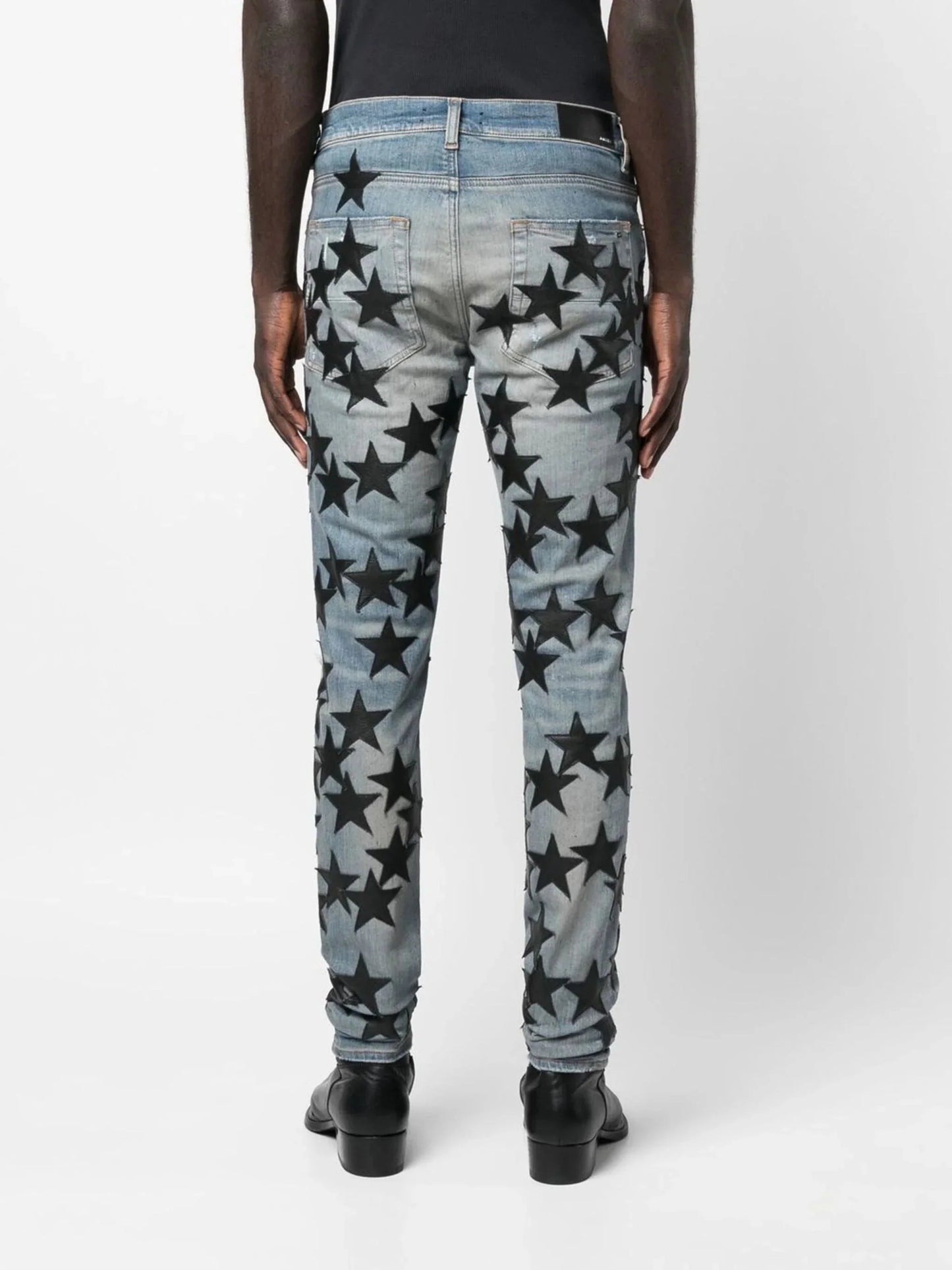 star patch skinny jeans by amiri - bottegalusso: premier destination for modern luxury menswear