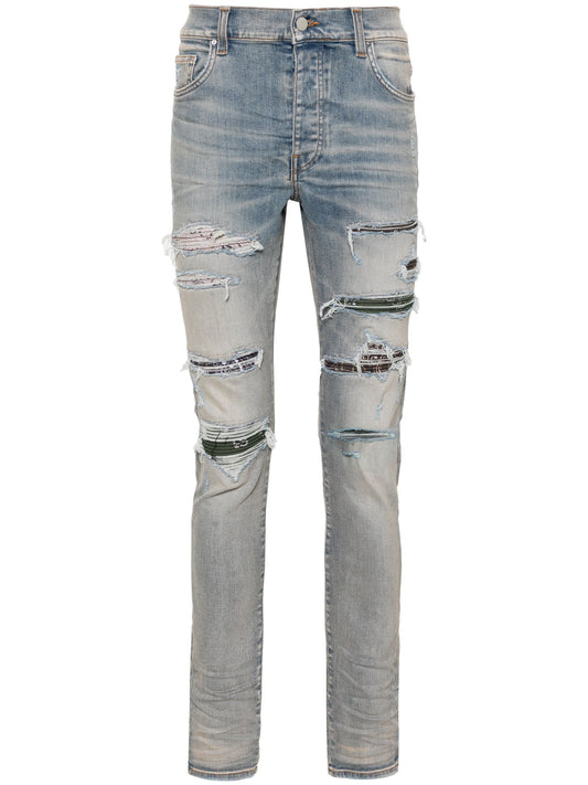 Trasher Ripped Skinny Jeans by Amiri - bottegalusso: Premier Destination for Modern Luxury Menswear